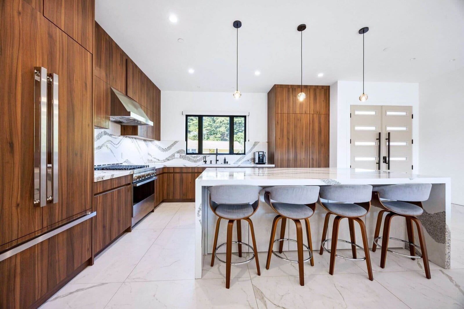 Modern chefs kitchen with wood cabinetry and large island