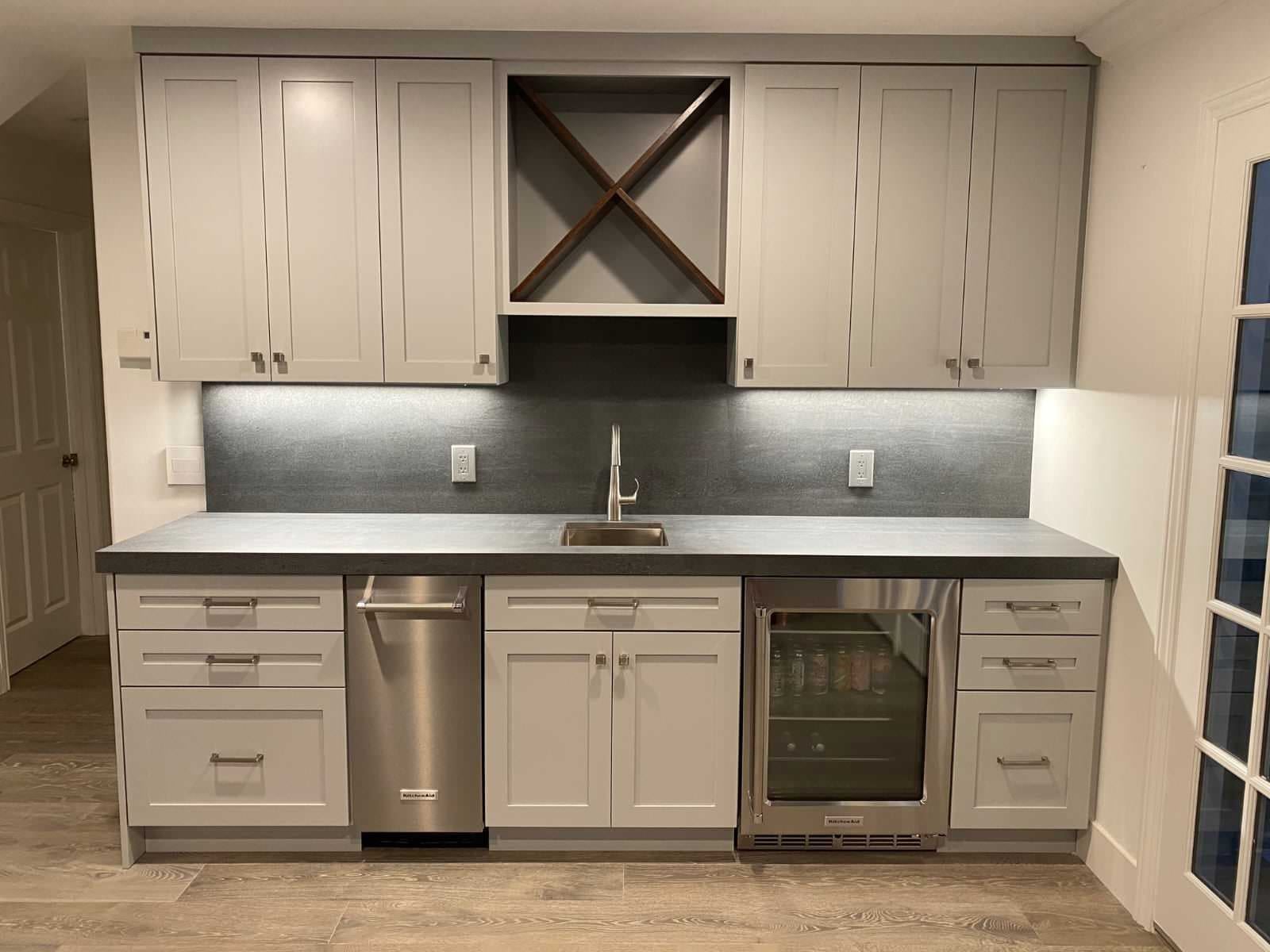 Custom wet bar with beverage refrigerator and wine storage