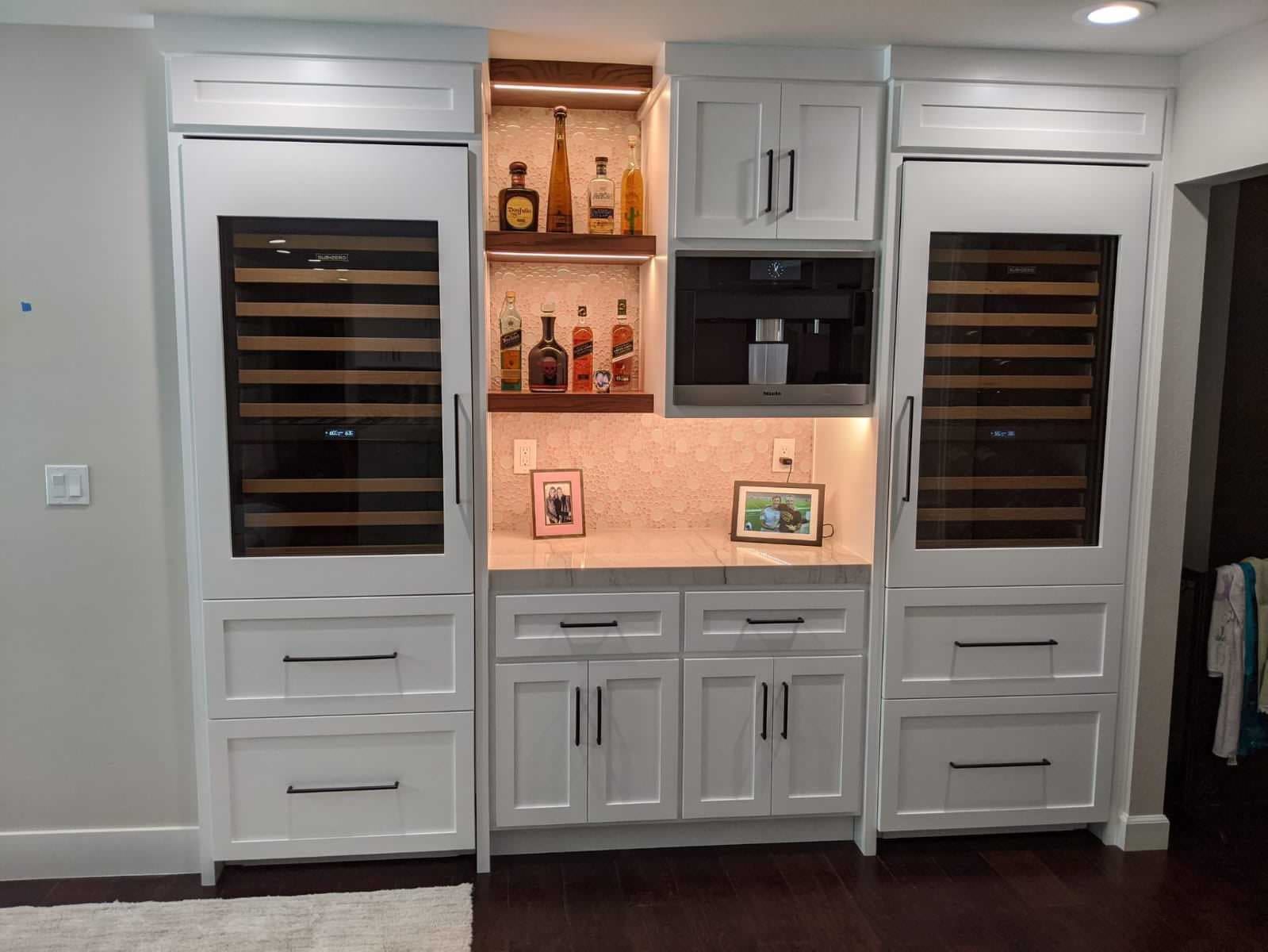 Built in wine wall with coffee station and illuminated shelving
