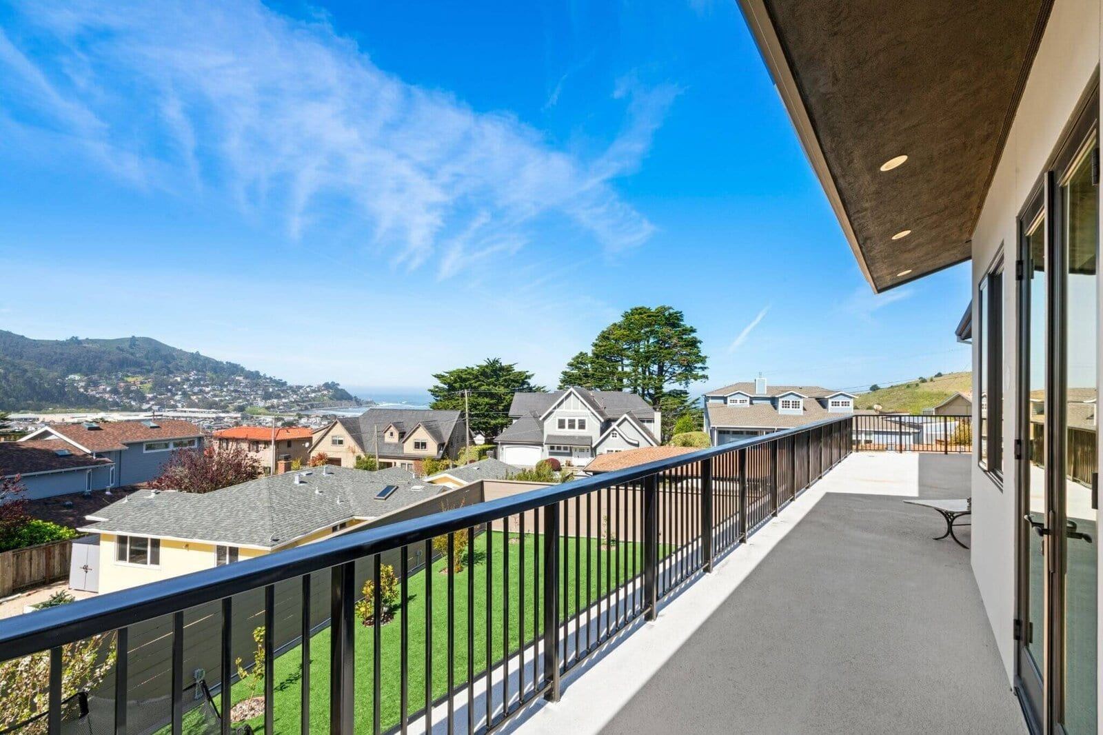Expansive upper deck with pacifica hillside views