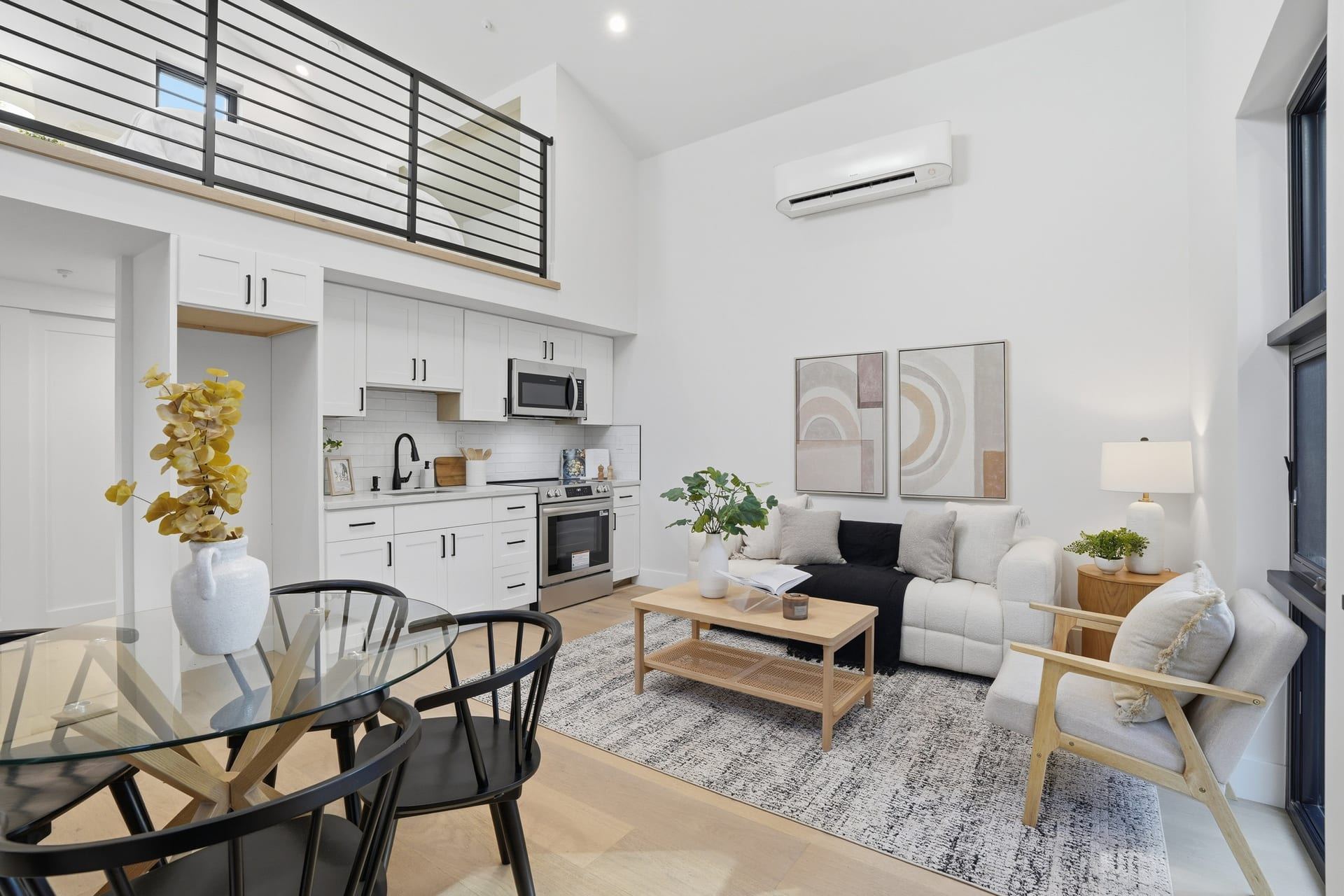Modern adu living room with full kitchen and double height ceiling