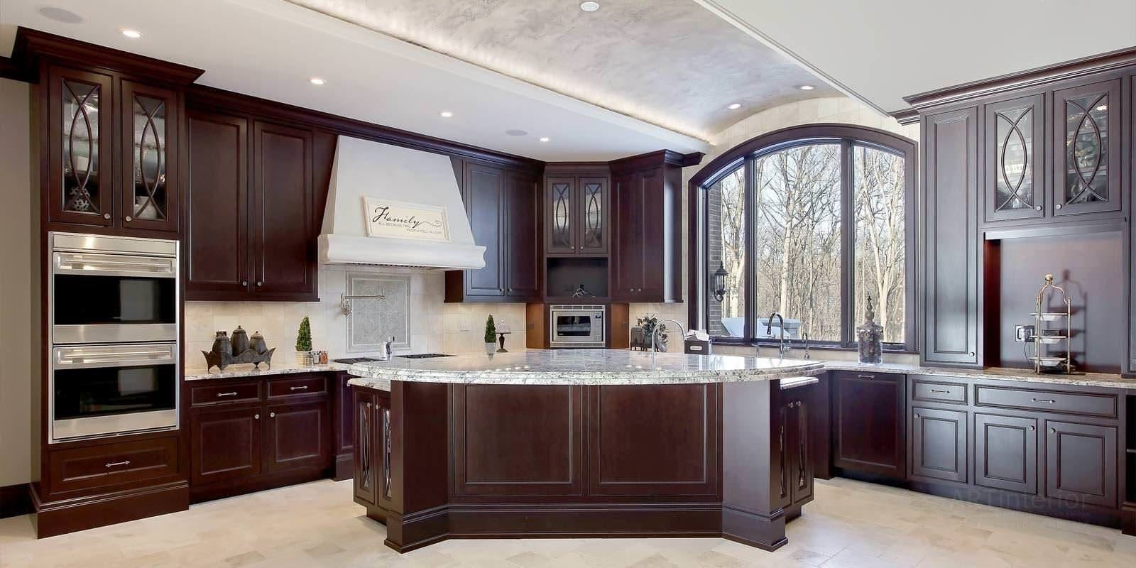 Traditional dark wood kitchen with arched picture window
