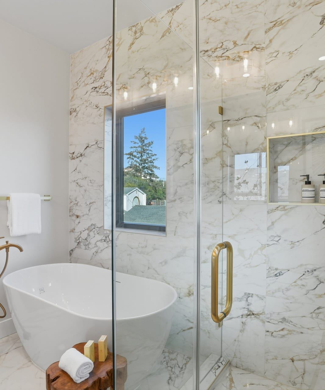 Spa bathroom with a long double vanity and veined tile