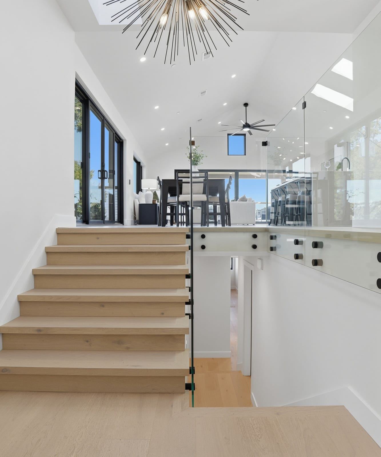 Modern wood staircase with a glass railing in a new Brisbane home