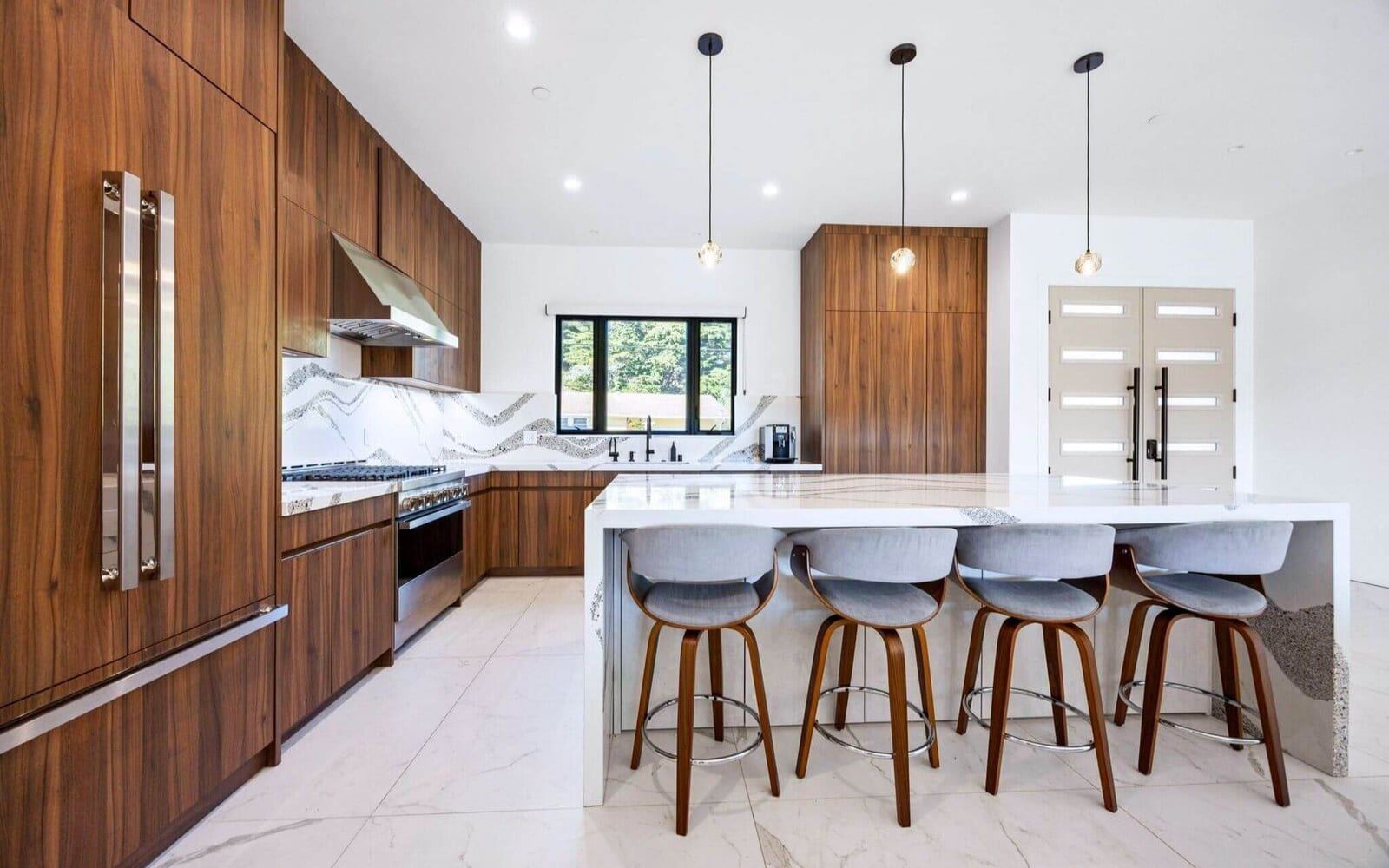 Modern chef's kitchen with wood cabinetry and a large island