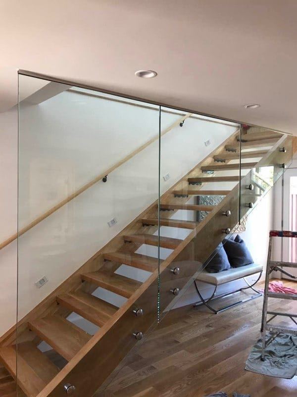 Custom open riser wood staircase with glass railing san mateo