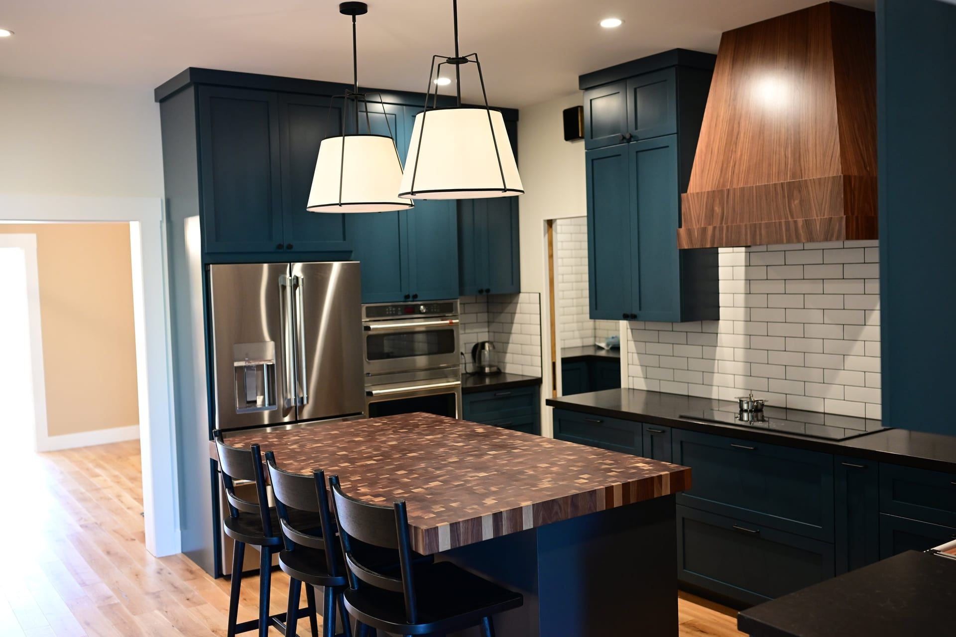 Teal shaker kitchen with end grain wood island