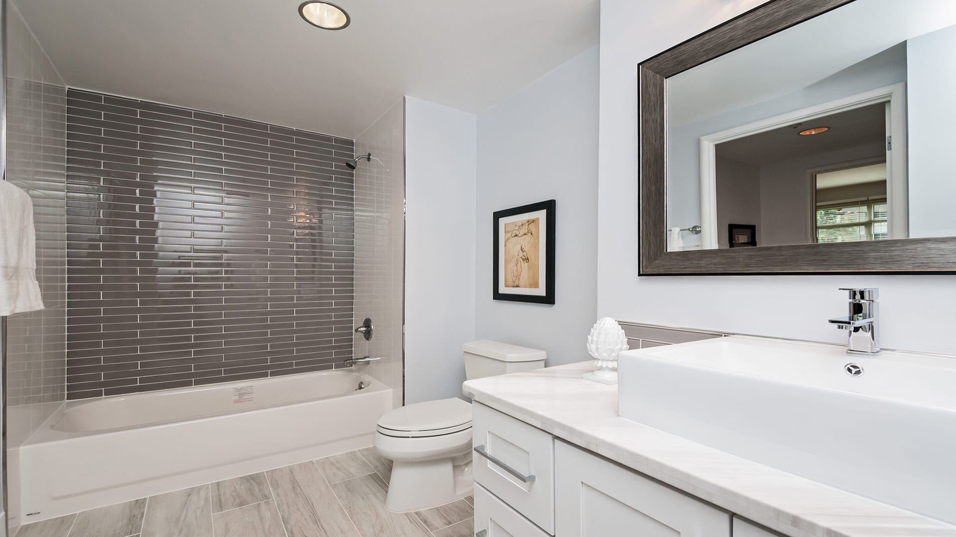 Modern gray bathroom with tub shower and floating vanity pacifica