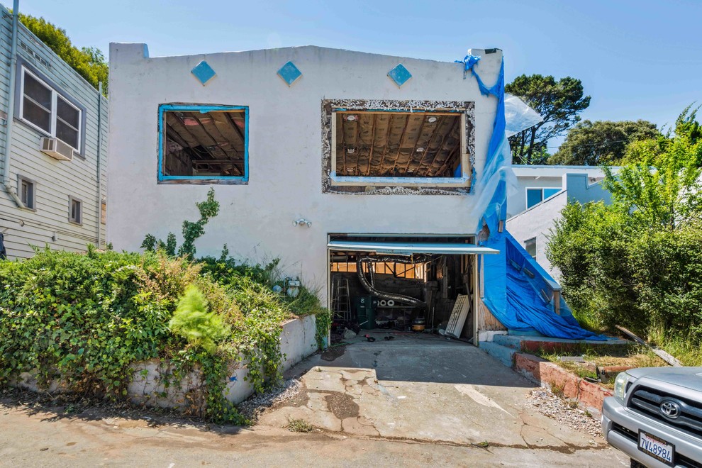 Home Exterior During Structural Demolition and Window Replacement
