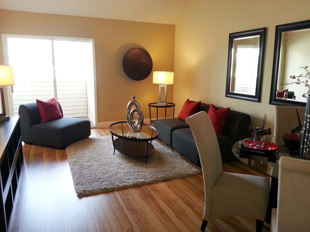 Compact Living and Dining Room with Warm Wood Flooring