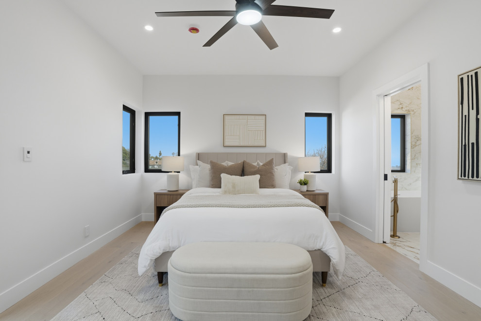 Primary Bedroom with Vaulted Ceiling and Black-Framed Windows