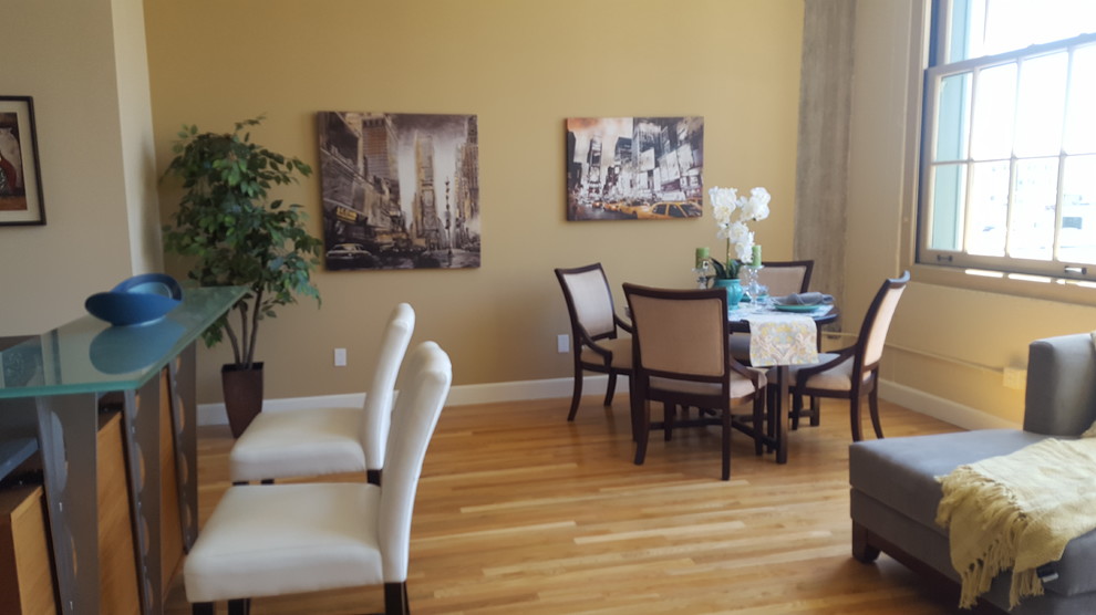 Open Loft Dining Area with Hardwood Flooring and Large Window