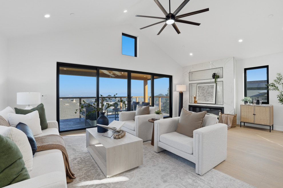 Vaulted Living Room with Linear Fireplace and Bay View