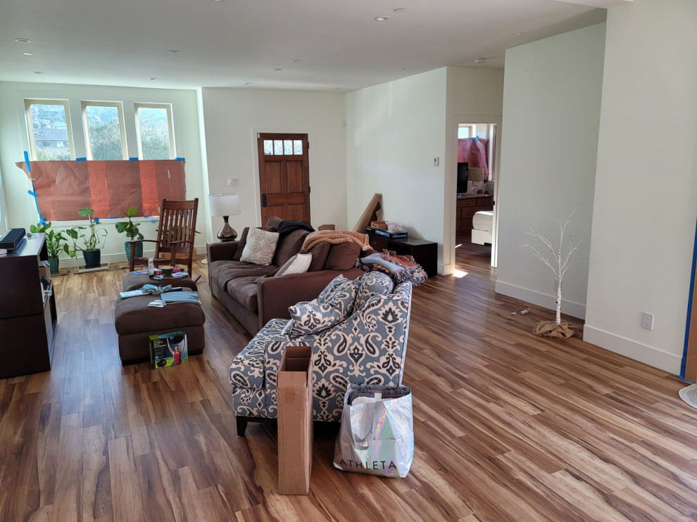 Open Living Room Remodel with Warm Wood-Look Flooring